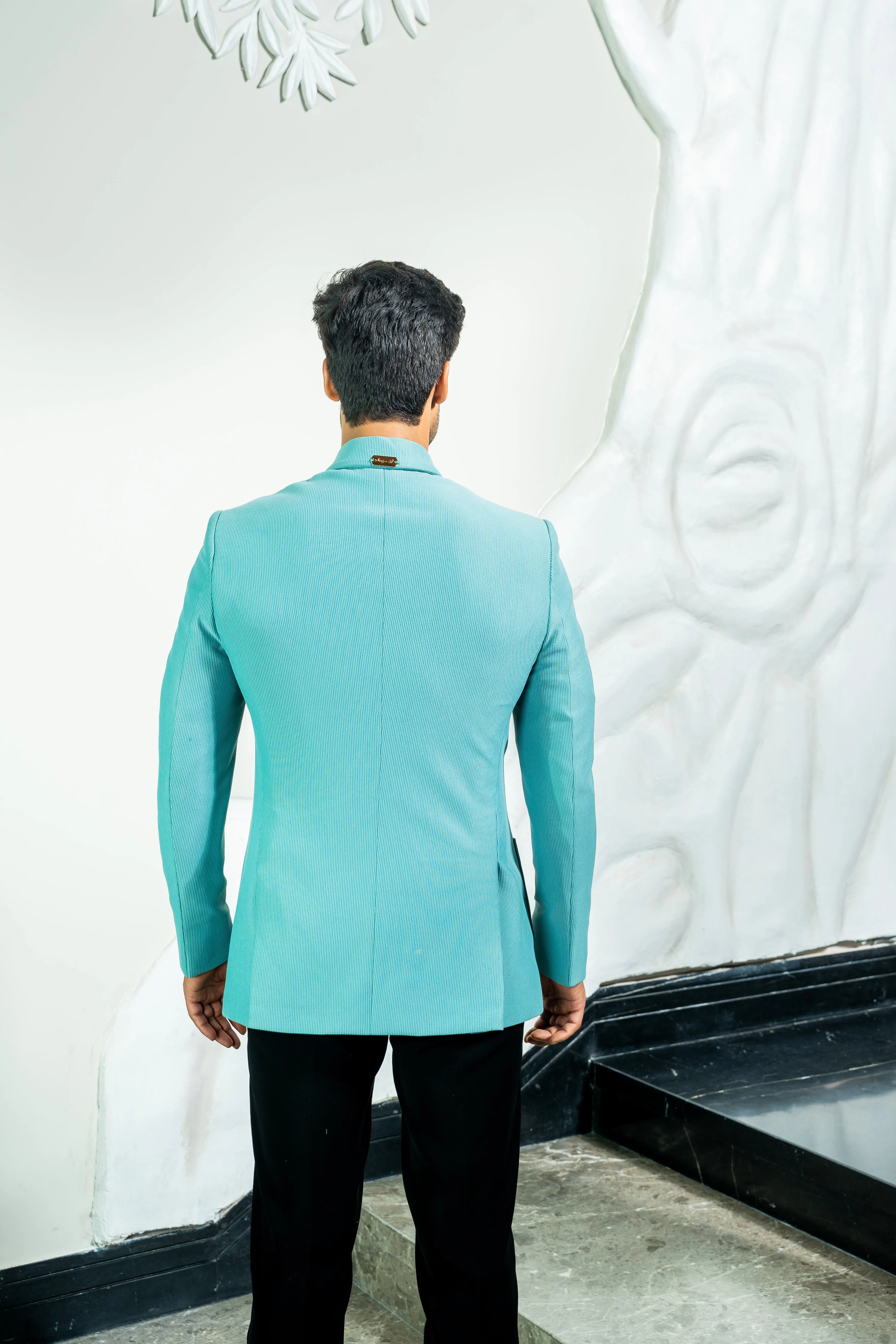 This bluish green codroys jacket
