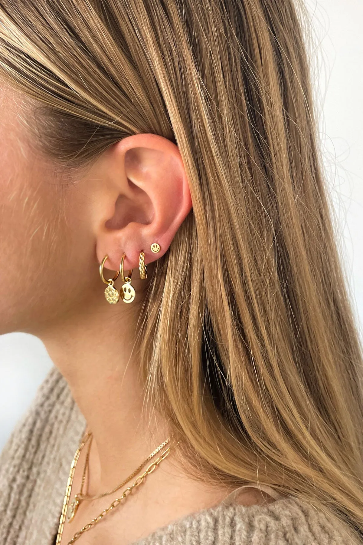 Twisted croissant hoop earring gold plated 13mm